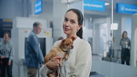 woman with dog at airport security