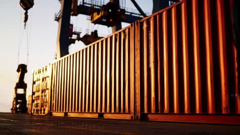 a sunset view of industrial shipping containers stacked and positioned, highlighting the colors and textures of containerization in a dynamic port setting