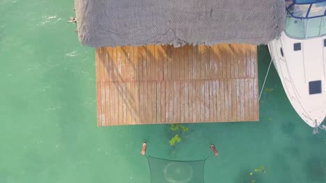 boat dock in caribbean lagoon, crystal clear water, vacation in tropical destination