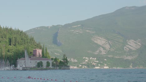 stunning lake view with mountains and buildings