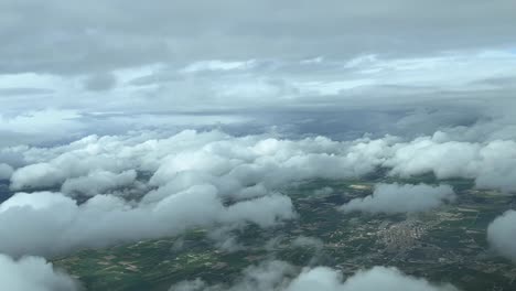 Cockpit-view-flying-between-layes-of-clouds-approaching-Palma-de-Mallorca-airport