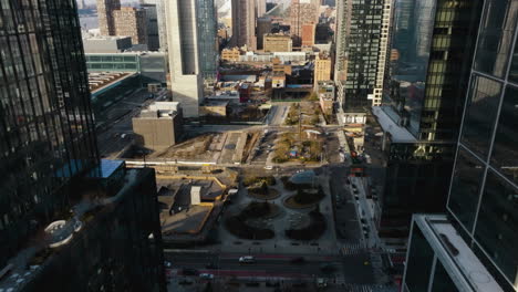 aerial view in middle of high-rise, towards hell's kitchen, spring in hudson yards, ny - tilt, drone shot