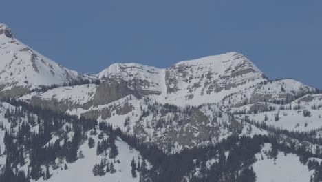 zoom out from high mountain cliffs in western wyoming