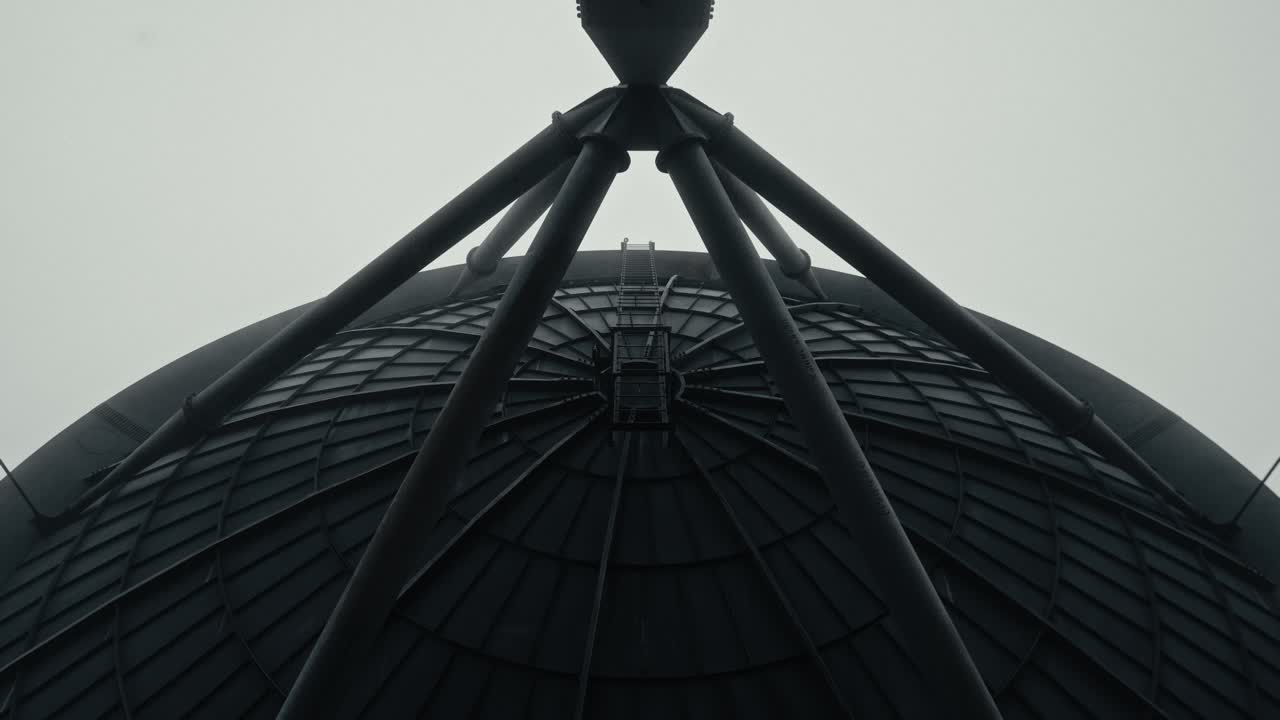 Upward View of a Large Metal Silo Dome Structure