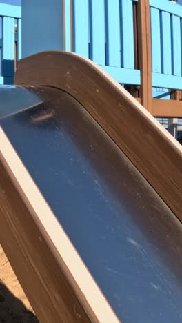 children's play area: close up of a slide on a park playground structure