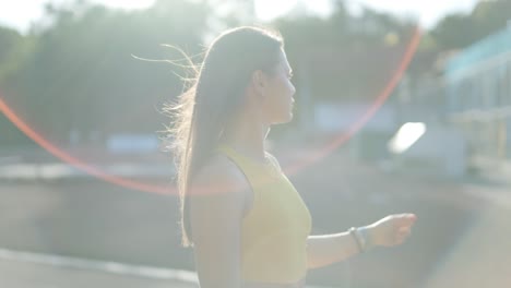 woman in yellow sportswear at the track