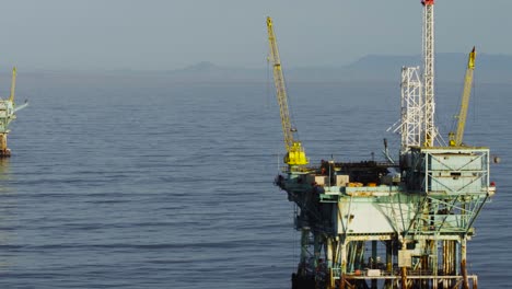 a beautiful aerial shot over oil derricks and platforms in the santa barbara channel california 3