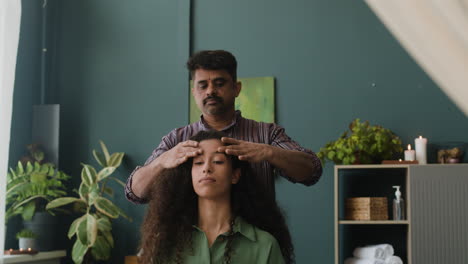 relaxing head massage in a spa setting