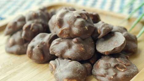 hand pick peanut chocolate candy on white  background ,