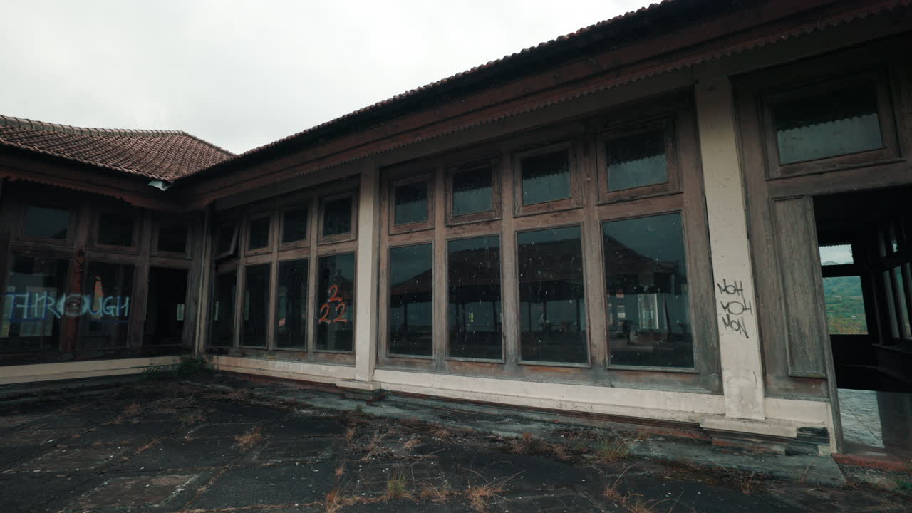 Abandoned Balinese Hotel with Graffiti and Overgrown Terrace