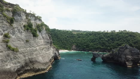 slow cliff side aerial flight toward batupadasan atuh