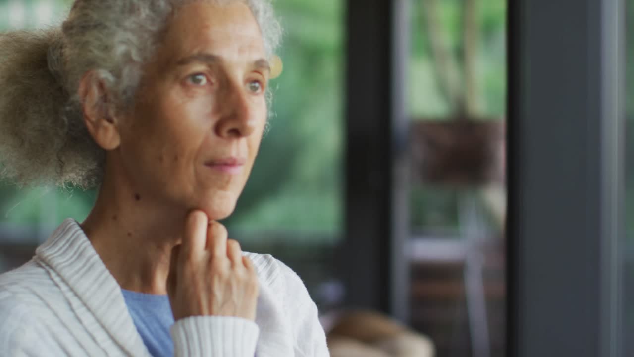 Senior mixed race woman holding her chin in thought