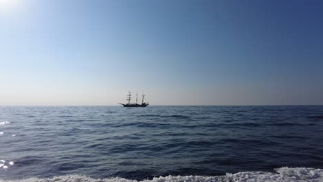 a pirate ship sailing by the sea, pov riding in a ferry