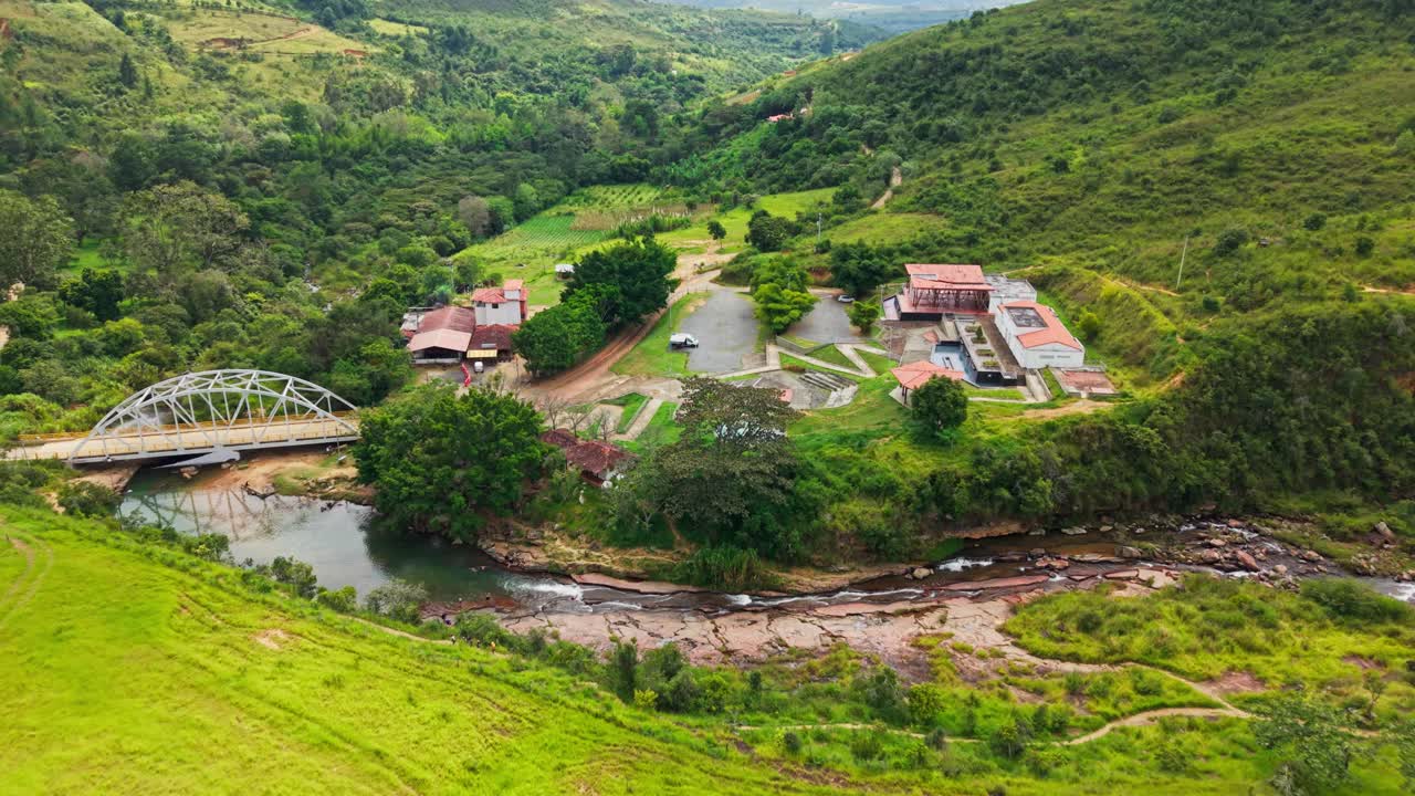 Stunning aerial footage revealing the lush green valley and motorhome in curiti santander, colombia