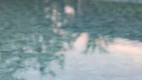 sunlight reflecting on gentle pool ripples