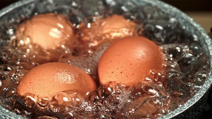 Brown Eggs Boiling in a Pot of Hot Water