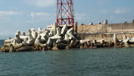 leaving harbour, concrete coastal defence dolos example