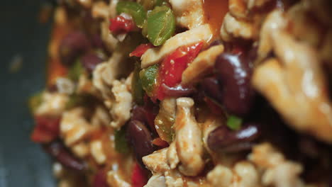 close up of appetizing and bubbling colorful ingredients for homemade fajitas