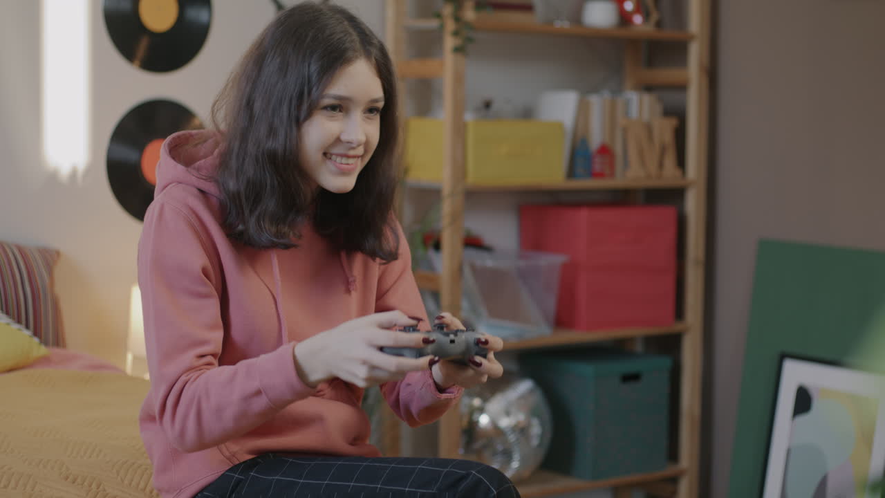 Teenage Girl Playing Video Games in Bedroom