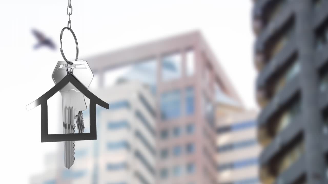 animación de las llaves de la casa de plata colgadas contra la vista borrosa de los edificios altos