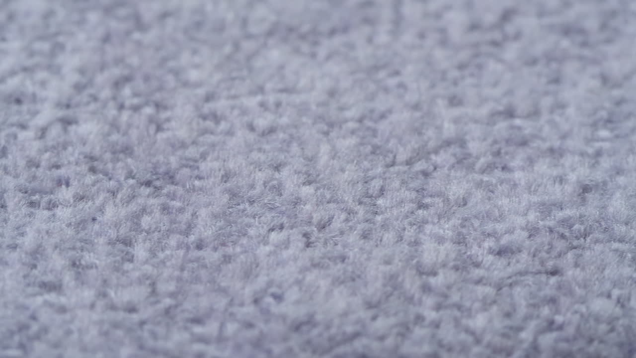Detail jemné šedé textury látky
