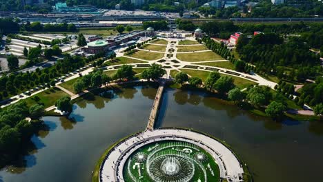 aerial view of a park and train station in a city