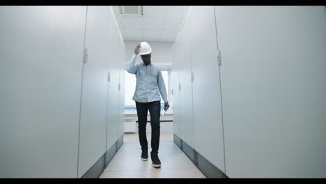 engineer walking in a server room