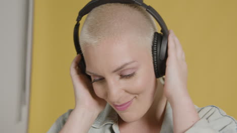 Female model poses with over ear headphones 09