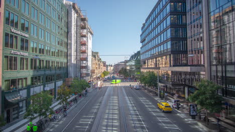 busy hamngatan street with tram, pedestrian and car traffic, day timelapse
