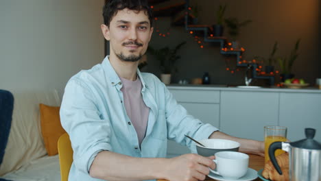 man enjoying breakfast at home