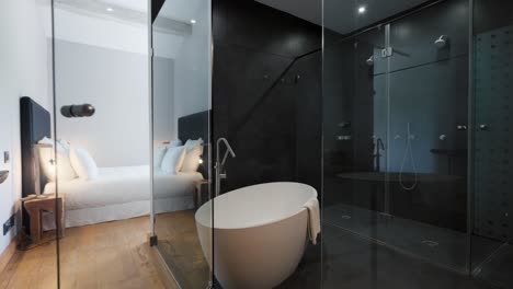 interior design of a stylishly decorated house at domaine sainte colombe, france, featuring a glass ceiling washroom with a nearby bedroom, ideal for concepts of modern luxury and seamless elegance.