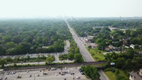 flying over a mississauga train station on a foggy summer day