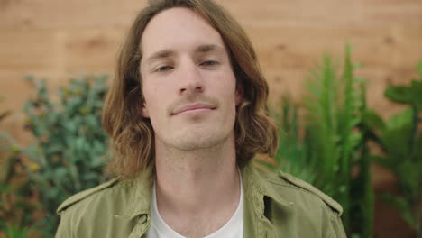 close up portrait of young caucasian man looking serious confident at camera