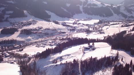 flight over a forest filming a small valley in the austrian hills