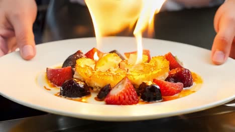 flambé dessert with strawberries and figs