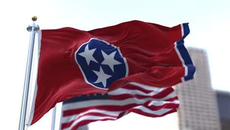 the flags of the tennessee state and united states of america waving in the wind. democracy and independence. american state. seamless 3d animation