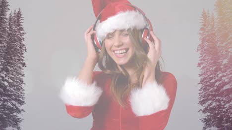 Animation-of-happy-woman-in-santa-hat-with-headphones-on