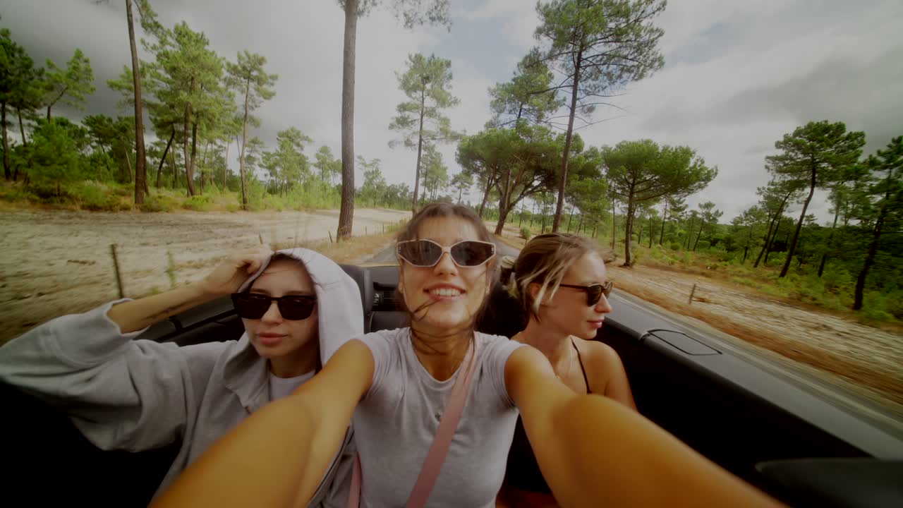 Friends on a road trip in a convertible