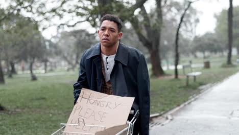 two men in a park during rainy weather