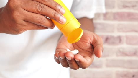 young men using sunscreen cream