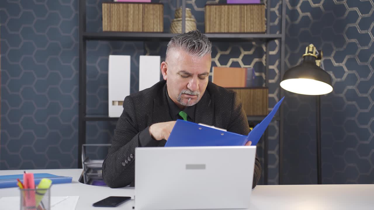 Businessman doing economic calculations.