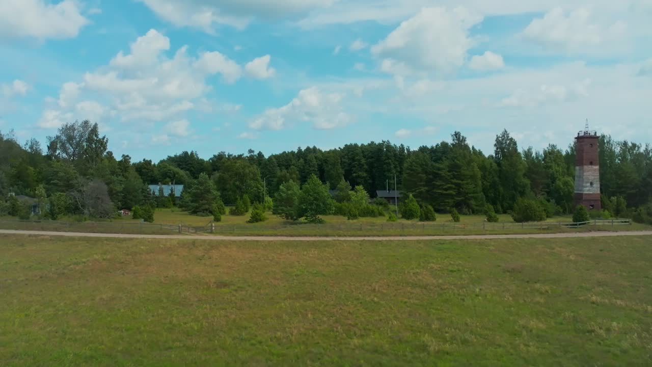 Rural landscape with country road, field and trees