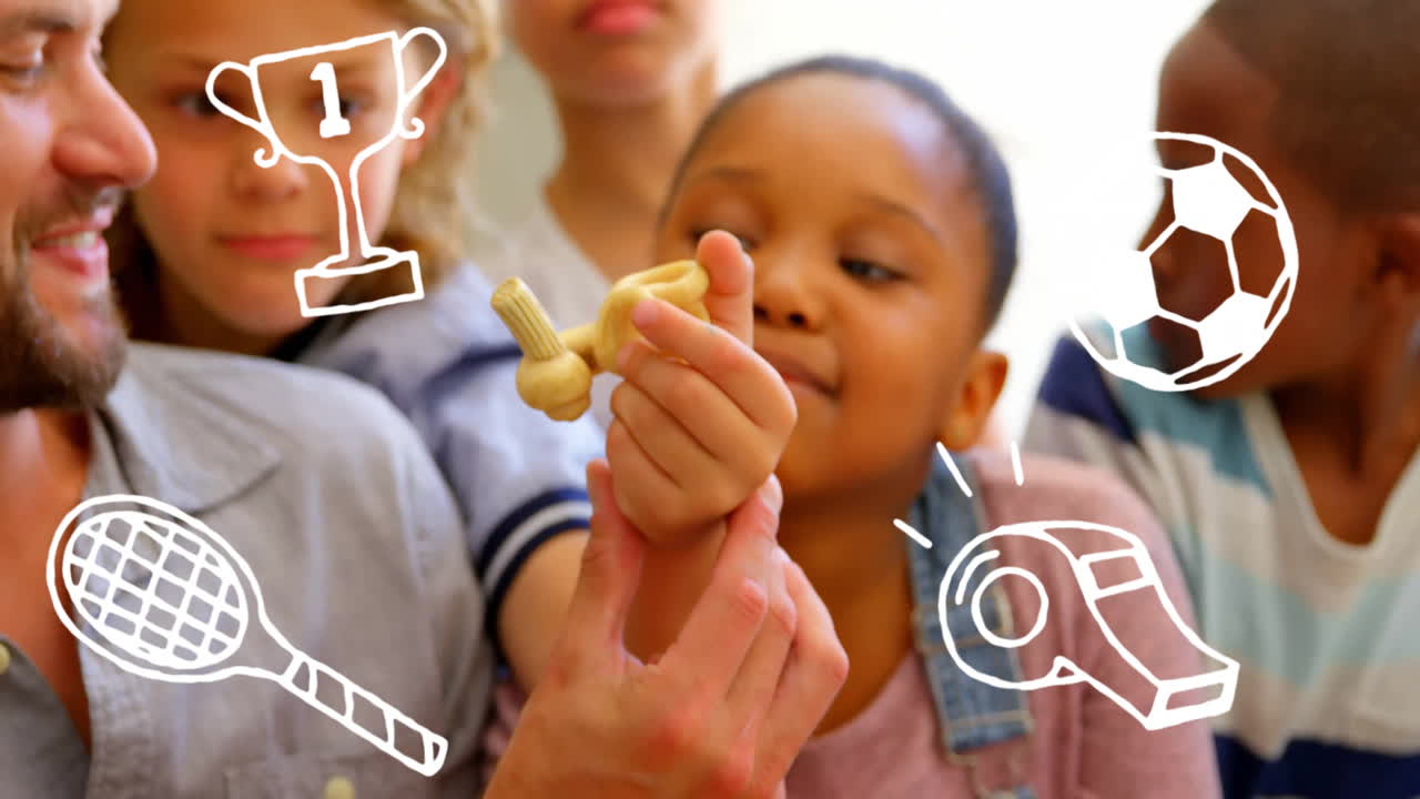 Holding toy, children with sports icons animation over them in school