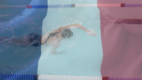 animation of flag of france over caucasian female swimmer