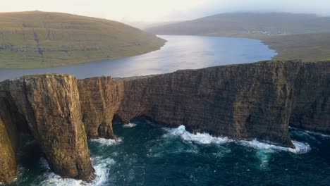 close range drone footage of the leitisvatn lake, aka the floating lake, on the vagar island in the faroe islands