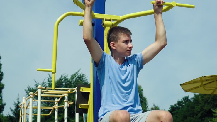 A teenager does sports on the playground 10