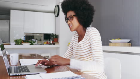 an attractive young businesswoman using a laptop