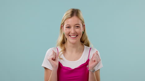 happy, excited and face of woman on blue