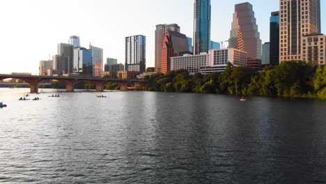 Low-drone-shot-of-ladybird-lake-and-downtown-austin-texas