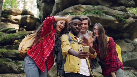 friends taking a selfie in a forest